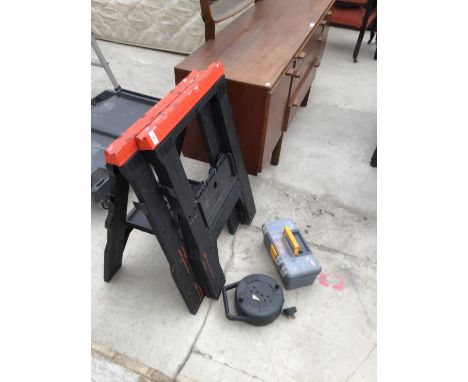 A PAIR OF PLASTIC COMPACT SAWHORSE BENCHES, AN EXTENSION CABLE AND A TOOLBOX WITH CONTENTS 