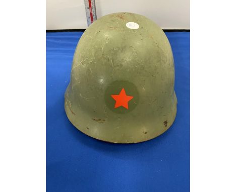 A COLD WAR YUGOSLAVIAN TIN HELMET WITH RED STAR 