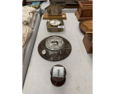 TWO CLOCKS TO INCLUDE A EUROPA ON A WOODEN BASE, AN ONYX EXAMPLE, A BAROMETER AND A MINATURE SUNDIAL 