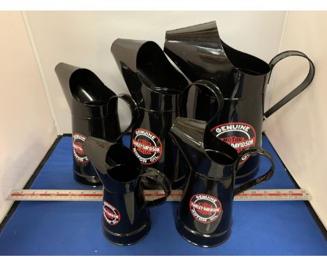 FIVE GRADUATED HARLEY DAVIDSON OIL JUGS 