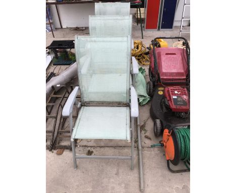 THREE PALE GREEN GARDEN CHAIRS, A PARASOL AND VARIOUS GARDEN TOOLS 