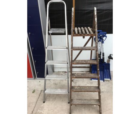 A VINTAGE SIX RUNG WOODEN STEP LADDER AND A ALUNIMIUM FOUR RUNG 