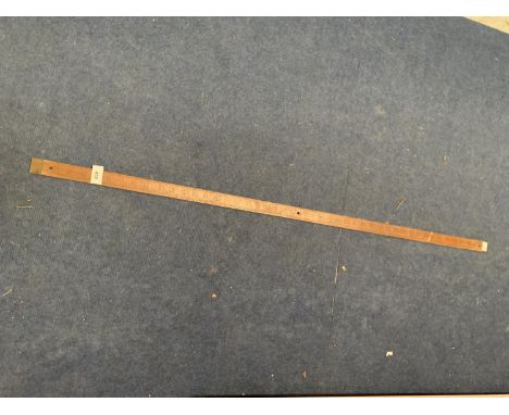 A VINTAGE WOODEN 4FT MEASURING STICK 
