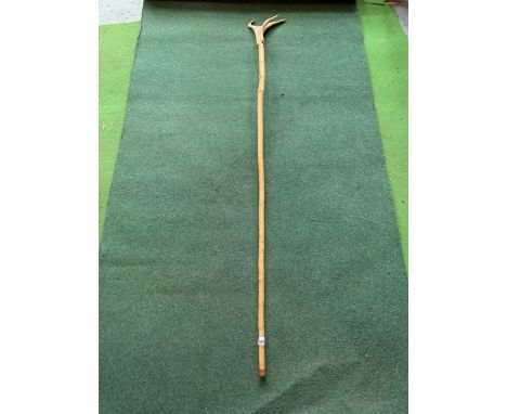A THUMB STICK WITH AN ANTLER TOP 