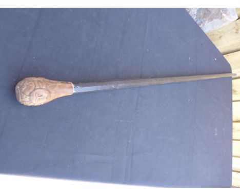 A CARVED WOODEN AFRICAN STICK - LENGTH 128 CM 