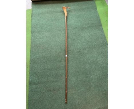 A THUMB STICK WITH AN ANTLER TOP 