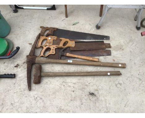 SEVERAL VINTAGE TOOLS TO INCLUDE SAWS, PICK AXE, LUMP HAMMER 