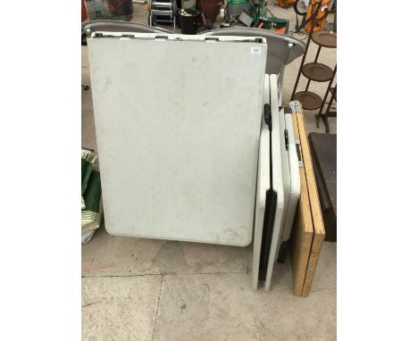 THREE PLASTIC FOLDING TABLES, A WOODEN PASTING TABLE AND A BLACK TOPPED CARD TABLE 