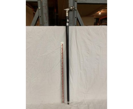A BLACK WALKING STICK WITH A CHROME JAGUAR HANDLE 