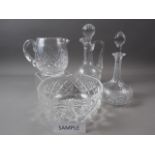 Two cut glass decanters and stoppers, a cut glass claret jug, three cut glass bowls and other cut