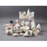 An Arcadian crested fireplace, two Goss pinecones, a Goss ancient canon, and a Goss Welsh Lady jug