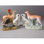 A 19th century Staffordshire greyhound spill vase, 11" high, a 19th century Staffordshire