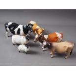 Four Beswick cows and two Beswick sheep (chip to one brown cow's hoof)