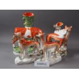 Three 19th century Staffordshire spill vases and a pair of greyhounds (restorations), largest