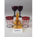 A pair of 19th century faceted beakers, an amber flashed and engraved cup and saucer and other
