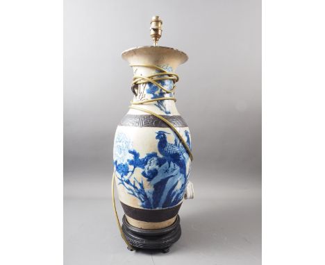 A Chinese porcelain blue and white floral decorated vase, now converted as a table lamp, 24" high (restored) 