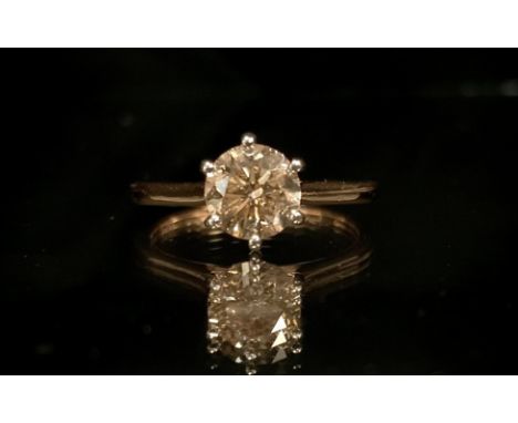 A fancy light brown certified diamond solitaire ring, round brilliant cut diamond 1.11ct, colour fancy light brown, Clarity S