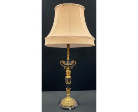 A gilt metal and black marble table lamp, Neoclassical swaged column, stepped foot, 54cm high to fittings. 