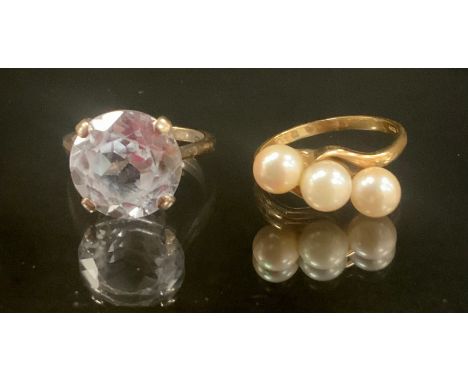 A cultured pearl 9ct gold mounted dress ring, twisting shoulders, size S, 3g gross, another pale blue solitaire, metal shank,