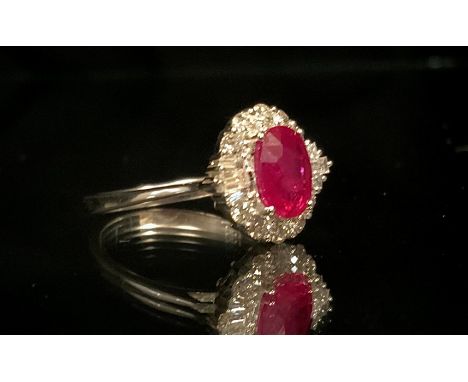 A Certified ruby and diamond cluster ring, central oval mixed cut pinkish red ruby, 1.75ct, surrounded by a halo of round bri