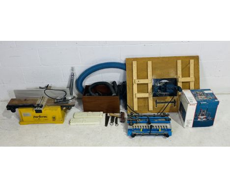 A Bosch GOF 1300 Ace Router mounted on handmade wooden base, along with a Perform Jointer Planer, Axminster Tools Centre dove