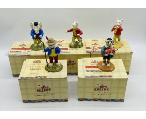 A collection of five boxed The Rupert Bear Collection ceramic figurines by Royal Doulton including Rupert's Silver Trumpet, R