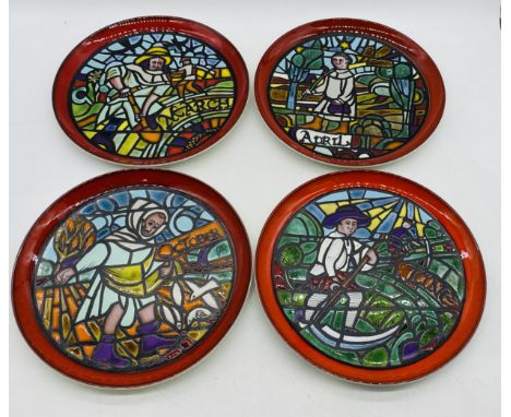A set of four Poole Pottery plates from the Medieval Calendar Series, designed by Tony Morris. Months included are March, Apr