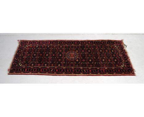 A red ground Eastern runner - 210cm x 86cm