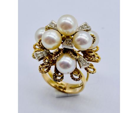 A 14ct gold ring set with diamonds and pearls marked "Sena", size K, total weight 13g