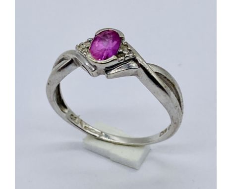 A ruby and diamond ring set in 9ct white gold, size Q