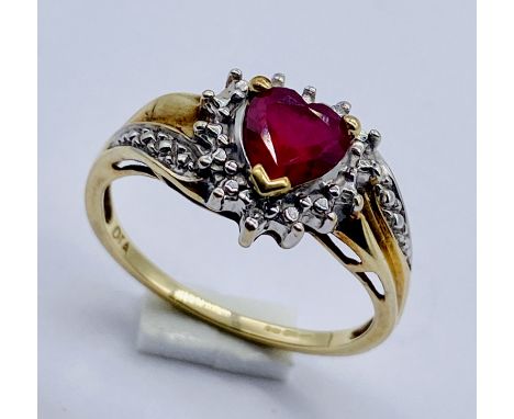 A heart shaped ruby and diamond cluster ring set in 9ct gold, size P 1/2