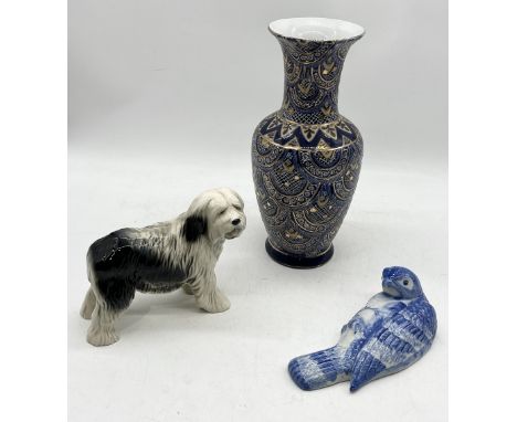 A large Chinese vase marked "Great Wall" along with a Melba Ware dog and wall sconce in the form of a bird