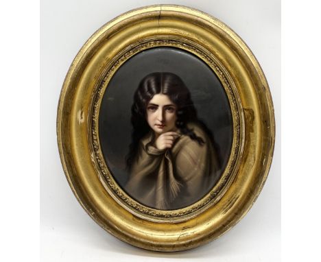 A late nineteenth century porcelain oval plaque painted with a portrait of a young girl wrapped in a shawl - impressed sceptr