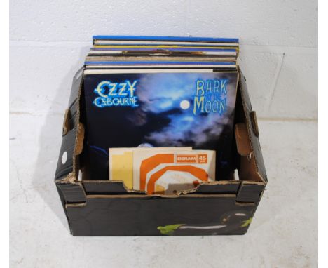 A quantity of various 12" vinyl records, including Ozzy Osbourne, Jethro Tull, ZZ Top, Dire Straits, The Beatles, Asia, Def L