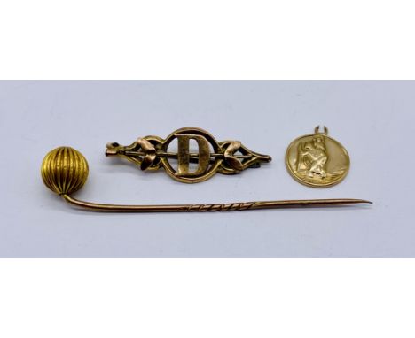 A 9ct gold brooch, St Christopher (A/F) and a stick pin with gold pin