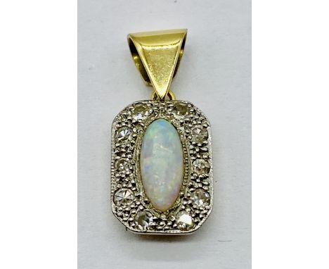 An unmarked Art Deco gold pendant set with diamonds and an opal