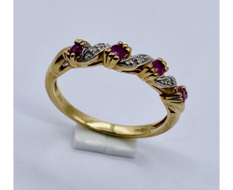 A ruby and diamond dress ring set in 9ct gold, size O