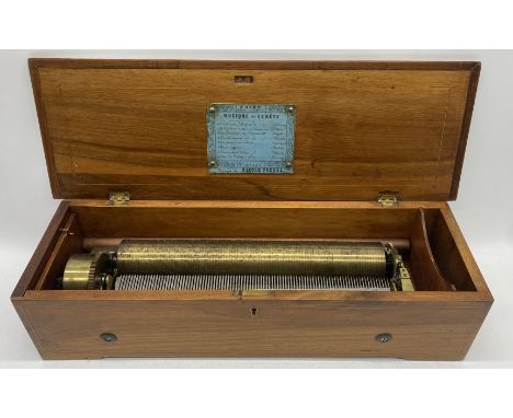 A Nicole Freres 19th century 8-airs music box, housed within a rosewood case with inlay to lid, the hinged lid bearing card l