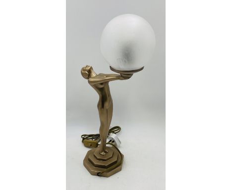 An Art Deco style table lamp in the form of a nude lady holding a globe - Overall height 50cm