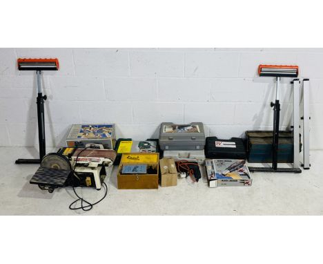 A collection of various power tools including a Black & Decker circular saw, Axminster Tools sheet finishing sander, Bosch or