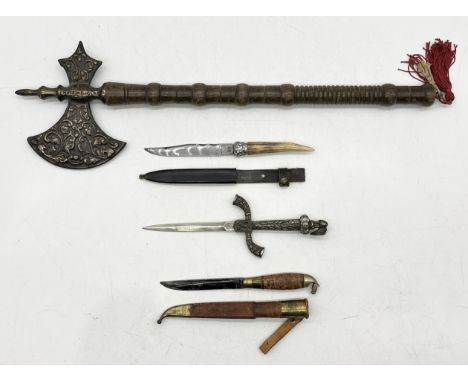 A collection of weaponry including replica ceremonial axe, William Rodgers antler handled dagger, Puukko style hunting knife 