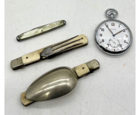 A Cyma military pocket watch marked GTSP along with folding campaign knife and fork etc. 
