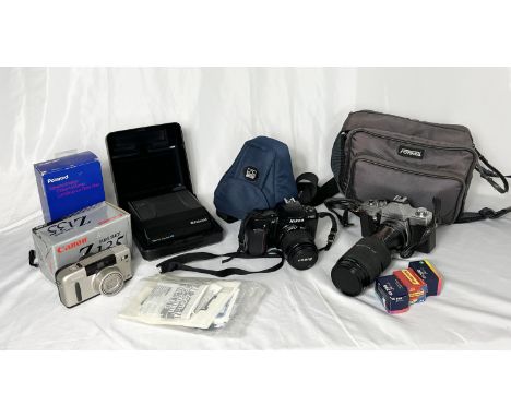 A collection of vintage cameras and lenses including Polaroid, Nikon, Sigma, Praktica etc. 
