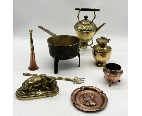 A collection of brass and copper including brass study of a cow, heavy pan on tripod legs by Jeffries & Price, brass and copp