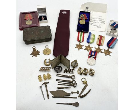 A collection of military awards and badges etc. including WWI and WWII medals, Artic Star, Russian medals, Malta Defence tie,