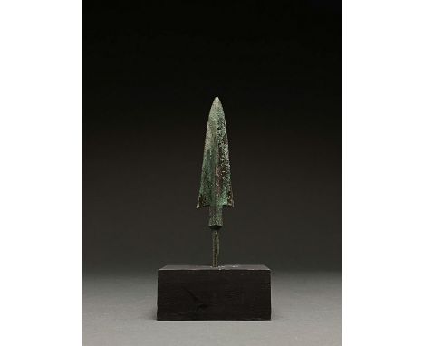 1200-700 BC, Greek Archaic Period. Bronze Age. A bronze spearhead with a flaring leaf-shaped, lentoid sectioned blade, a rais
