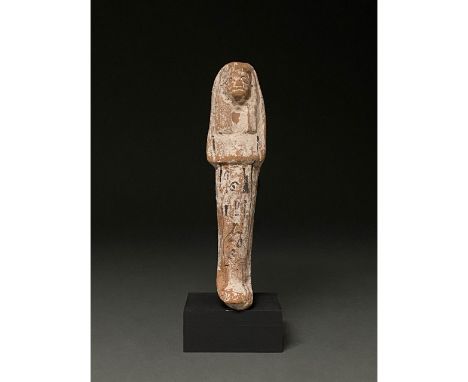Ca.1070-945 BC Egyptian, Early Third Intermediate Period. Beautiful terracotta-coloured ceramic ushabti figure wearing a trip