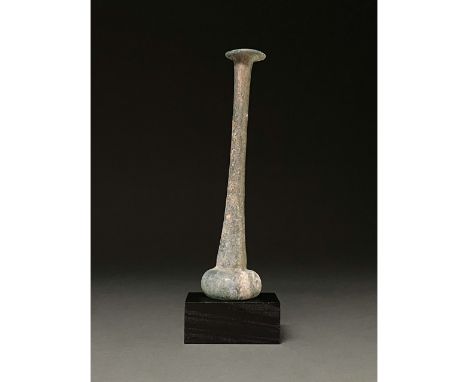 100-300 AD. Roman. Light greenish-blue flask with flaring, folded rim, very long neck and small, globular body. Glass was a m