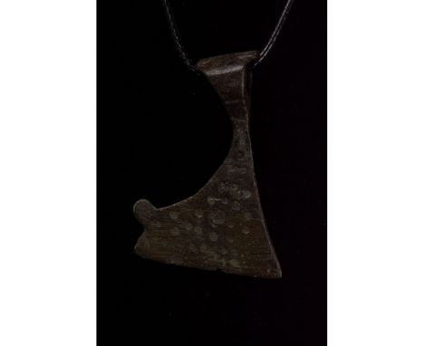 700-1100 AD, Viking Age. A bronze example of an axe or Perun amulet comprising a suspension loop and a stylised axe with a no