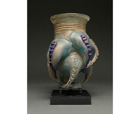 Possibly Grand Tour period. Roman-style greenish-blue glass â€œclaw beakerâ€ with thickened rim, restricted neck, globular bo